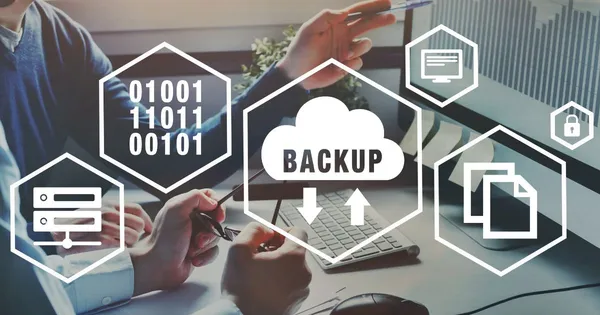 IT professionals at a desk reviewing a monitor, overlaid with cloud backup, server, and data security icons.