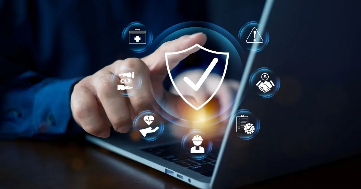 Explore identity and access management solutions. A person uses a laptop protected by a glowing security shield and multi-industry icons.
