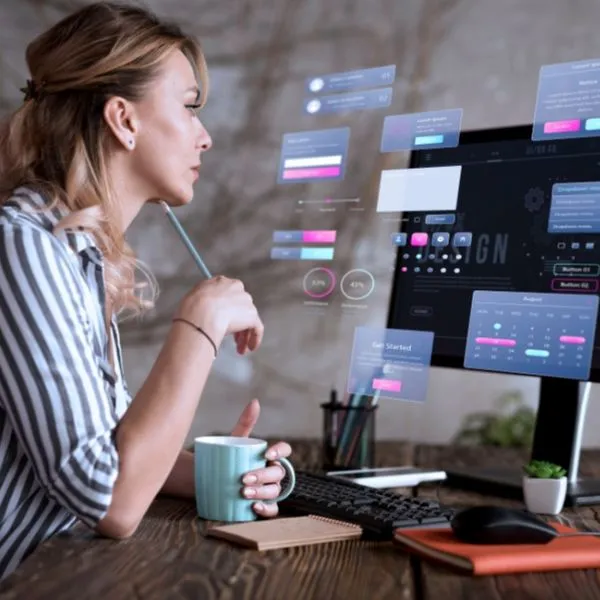 A focused business professional reviewing a dynamic digital dashboard with floating user interface (UI) elements and performance analytics.